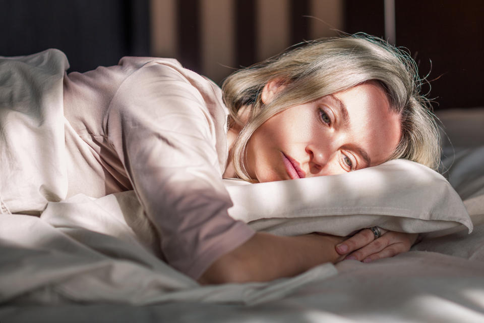 Early menopausal woman having sleep problems or insomnia.  (Photo via Getty Images)