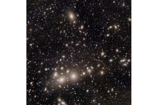An image of many stars and galaxies in space.