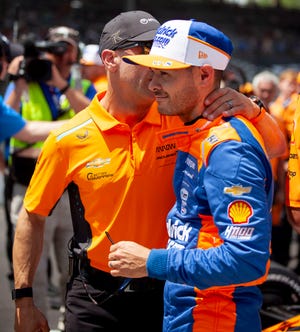 Tony Kanaan greets Arrow McLaren/Rick Hendrick driver Kyle Larson (17) after his second run Saturday, May 18, 2024, during qualifying for the 108th running of the Indianapolis 500 at the Indianapolis Motor Speedway.