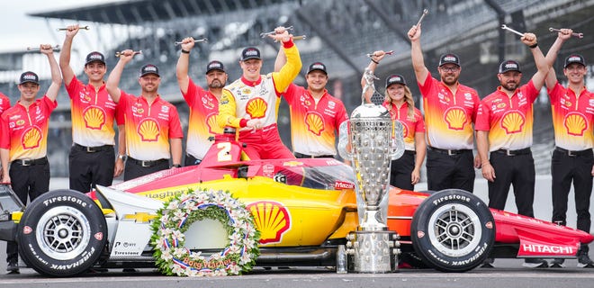 Team Penske driver Josef Newgarden (2) and his crew pose for a photo Monday, May 27, 2024, after winning the 108th running of the Indianapolis 500 at the Indianapolis Motor Speedway.
