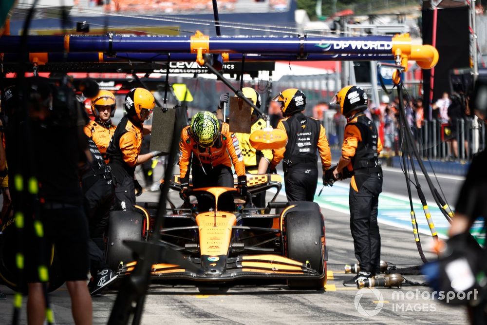 Lando Norris, McLaren MCL38, retires in the pit lane after contact with Max Verstappen, Red Bull Racing RB20, while fighting for the lead